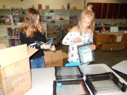 Helpers unwrapping cases for the Chromebooks.