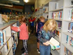 Students using shelf markers