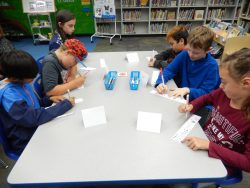 Students in the Media Center Making Shelf Markers